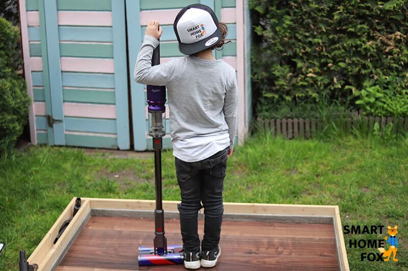 The Dyson Omni-glide next to a person